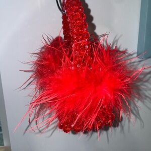Red Beaded Handbag with Feather Accents